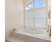 Relax in this whirlpool tub with large windows and natural light at 4865 Featherbed Ln, Sarasota, FL 34242