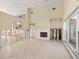 Open living area with high ceilings and tiled floors; currently under renovation at 4865 Featherbed Ln, Sarasota, FL 34242