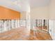 Living room undergoing renovation with orange accent wall at 4865 Featherbed Ln, Sarasota, FL 34242
