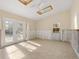 A sunroom under renovation with skylights and new flooring at 4865 Featherbed Ln, Sarasota, FL 34242