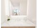 Modern bathroom with marble countertop and sleek sink at 4950 Remington Dr # 407, Sarasota, FL 34234