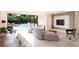 Living room with pool view and modern furniture at 4950 Remington Dr # 407, Sarasota, FL 34234