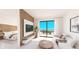 Bright living room with sliding doors to balcony and partial bedroom view at 4950 Remington Dr # 407, Sarasota, FL 34234