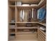 Well-organized walk-in closet with ample shelving and hanging space at 4950 Remington Dr # 407, Sarasota, FL 34234