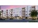 Modern apartment building with parking and landscaping at 4950 Remington Dr # 407, Sarasota, FL 34234