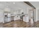 Modern kitchen with stainless steel appliances and white cabinets at 4933 Pebble Beach Ave, Sarasota, FL 34234