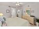 Main bedroom with light colored flooring, dresser and a ceiling fan at 5230 Hyland Hills Ave # 1314, Sarasota, FL 34241