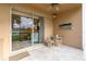 Screened patio with glass doors and view of the water at 5230 Hyland Hills Ave # 1314, Sarasota, FL 34241