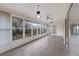Sunroom with tile floors, ceiling fan, and plenty of natural light at 5502 Garden Lakes Oak, Bradenton, FL 34203