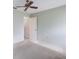 Simple bedroom with ceiling fan and access to bathroom at 5502 Garden Lakes Oak, Bradenton, FL 34203