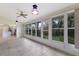 Sunroom with tile floors, ceiling fan and views of the backyard at 5502 Garden Lakes Oak, Bradenton, FL 34203