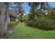 Mature landscaping and expansive grassy backyard at 5502 Garden Lakes Oak, Bradenton, FL 34203