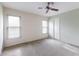 Spacious bedroom with ceiling fan and two windows at 5502 Garden Lakes Oak, Bradenton, FL 34203