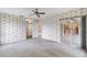 Bedroom with floral wallpaper and access to the kitchen at 5502 Garden Lakes Oak, Bradenton, FL 34203