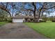 House exterior showcasing a white and brown color scheme at 5502 Garden Lakes Oak, Bradenton, FL 34203