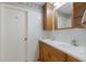 Bathroom with double vanity and wood cabinets at 5502 Garden Lakes Oak, Bradenton, FL 34203