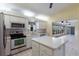 Kitchen with stainless steel appliances and an island at 5502 Garden Lakes Oak, Bradenton, FL 34203