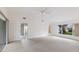 Large main bedroom with sliding glass doors and carpet at 5502 Garden Lakes Oak, Bradenton, FL 34203