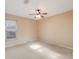 Spacious bedroom with ceiling fan and neutral decor at 5502 Garden Lakes Oak, Bradenton, FL 34203