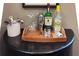 Home bar with liquor, glassware, and bar tools at 6016 28Th W St # 6016, Bradenton, FL 34207