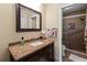 Bathroom with granite vanity and walk-in shower at 6016 28Th W St # 6016, Bradenton, FL 34207