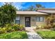 Condo's front entrance with landscaping and walkway at 6016 28Th W St # 6016, Bradenton, FL 34207