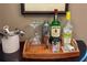 Home bar with liquor, glassware, and bar tools at 6016 28Th W St # 6016, Bradenton, FL 34207