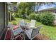 Relaxing patio with table and chairs, overlooking the grassy backyard at 6016 28Th W St # 6016, Bradenton, FL 34207