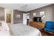 Main bedroom with large bed, dresser, and en-suite bathroom at 6016 28Th W St # 6016, Bradenton, FL 34207