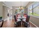 Bright dining area with glass table and wicker chairs at 6016 28Th W St # 6016, Bradenton, FL 34207
