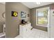 White kitchen with breakfast bar and view to living room at 6016 28Th W St # 6016, Bradenton, FL 34207