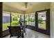Screened sunroom with backyard view and tiled floor at 6016 28Th W St # 6016, Bradenton, FL 34207