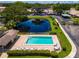 Aerial view showing the community pool and location of property at 6016 28Th W St # 6016, Bradenton, FL 34207