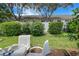 Small patio with table and chairs, and view of backyard at 6016 28Th W St # 6016, Bradenton, FL 34207