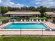 Community pool with lounge chairs, ready for relaxation at 6016 28Th W St # 6016, Bradenton, FL 34207
