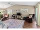 Spacious living room featuring a comfy armchair and large rug at 6016 28Th W St # 6016, Bradenton, FL 34207