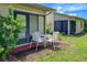 Private patio with table and chairs, perfect for outdoor dining at 6016 28Th W St # 6016, Bradenton, FL 34207