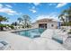 Inviting community pool with surrounding lounge chairs at 818 Wexford Blvd # 818, Venice, FL 34293