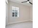 Simple bedroom with large window and ceiling fan at 8332 Sea Glass Ct, Sarasota, FL 34240