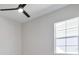 Bedroom featuring a modern ceiling fan, a bright window, and neutral wall paint at 8332 Sea Glass Ct, Sarasota, FL 34240