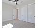 Bedroom with double doors leading to a bathroom and closet at 8332 Sea Glass Ct, Sarasota, FL 34240