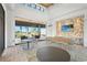 Bright clubhouse featuring neutral tones, an accent wall, and a view of outdoor recreation at 8332 Sea Glass Ct, Sarasota, FL 34240