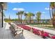 Outdoor seating near community tennis and pickleball courts with manicured landscaping at 8332 Sea Glass Ct, Sarasota, FL 34240
