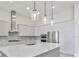 Modern kitchen with stainless steel appliances and an expansive island at 8332 Sea Glass Ct, Sarasota, FL 34240