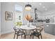 Bright dining area adjacent to a modern kitchen at 8332 Sea Glass Ct, Sarasota, FL 34240
