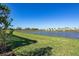 Community lakefront view with homes and lush landscaping at 8332 Sea Glass Ct, Sarasota, FL 34240