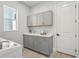 Laundry room featuring a gray shaker cabinets, quartz countertop, a utility sink, and a new washer at 8332 Sea Glass Ct, Sarasota, FL 34240