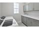 Bright laundry room with washer, dryer and cabinets at 8332 Sea Glass Ct, Sarasota, FL 34240