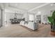 Expansive living area featuring a modern kitchen, ample seating, and seamless flow for entertaining guests at 8332 Sea Glass Ct, Sarasota, FL 34240