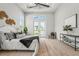 Tranquil main bedroom with a view of the pool, tray ceiling, and stylish decor at 8332 Sea Glass Ct, Sarasota, FL 34240